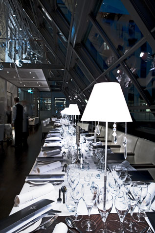 Design and decoration for the White Christmas event at Copenhagen Island Hotel, 2008. This is a detail of the table setting where the white lampshades were made to order with small sparkling crystals reflecting the light